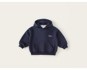 Close-up of white embroidered lettering and kangaroo pocket on navy blue kids hoodie