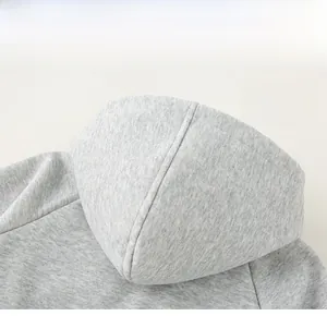 Close-up of the grey hooded design on a cotton knit sweatshirt for toddler boys