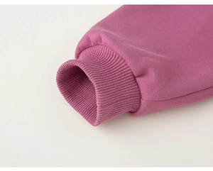 Close-up of elastic ribbed cuffs on a kids cotton hoodie with knit texture