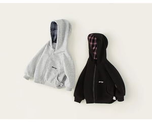 Detail of kids hooded jackets with premium plaid lining and high-density cotton texture