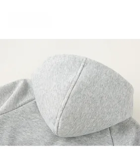 Detail view of double-stitched seam on a grey cotton hood of a kids' hooded sweatshirt