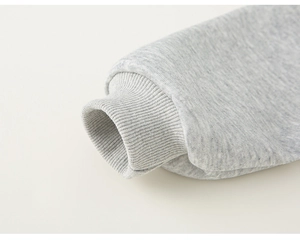 Detailed macro view of the grey ribbed cuffs on this children's cotton hoodie jacket