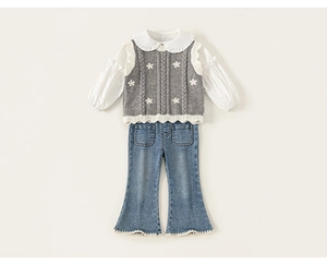 Detail of girls floral grey knit vest over white ruffled shirt with flare denim jeans