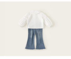 Detail of white ruffle collar shirt and flare jeans with lace trim for girls