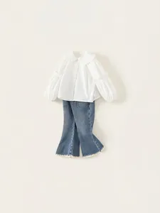 Girls spring outfit with white Peter Pan collar shirt and blue lace flared jeans