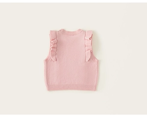 Detail of pink knit vest featuring sweet ruffled shoulders and soft ribbed collar
