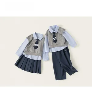 Detail view of British style school uniform sets with vest, shirt, tie and skirt or pants