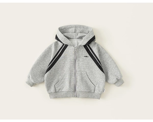 Close-up of a light grey kids zip-up hoodie with black sleeve stripes and ribbed cuffs
