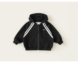 Close-up of kids black hoodie featuring zipper detail and embroidered logo