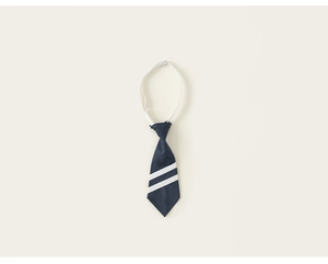 Detail of navy blue pre-tied necktie with white stripes and adjustable elastic strap
