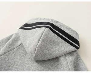 Close-up of heather grey hoodie featuring black double stripes on the hood detail
