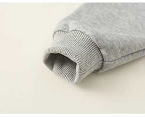 Close-up of ribbed cuffs on a heather gray cotton sports sweatshirt for boys