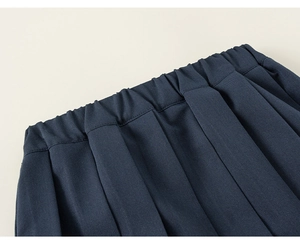 Detail of navy blue pleated skirt with elastic waistband for school style outfits
