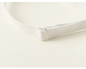 Macro shot of high-elastic white webbing with a transparent plastic adjustable buckle
