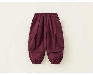 Detail view of burgundy kids cargo pants showing elastic waist and side flap pockets