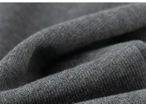 Close-up of soft grey knit fabric texture showing premium weaving quality for children trousers