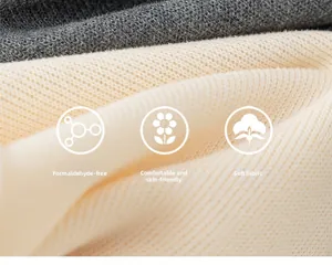 Macro shot of soft breathable knitted fabric in beige and dark grey for kids pants