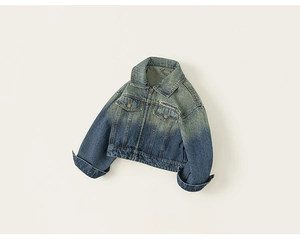 Detailed view of kids denim jacket featuring gradient wash finish and metal buttons