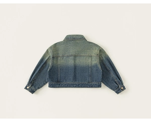Macro detail of kids vintage denim jacket featuring gradient wash and golden buttons