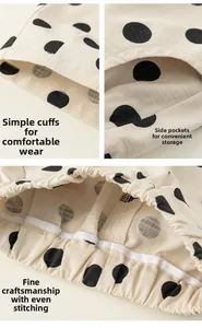Detail view of polka dot cotton trousers featuring elastic waist and side pockets
