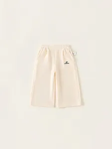 Minimalist cream girls wide-leg trousers with elastic waist and soft knit fabric