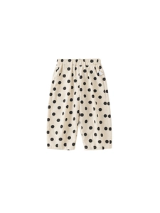 Kids loose casual trousers with black polka dots on beige breathable cotton fabric