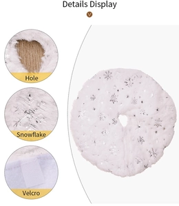 Detailed display of white faux fur Christmas tree skirt with silver snowflakes and velcro