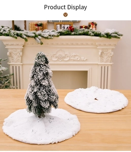Detail of white faux fur Christmas tree skirt with shiny silver star embroidery