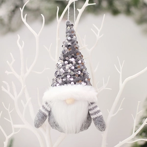 Christmas faceless gnome ornament with silver sequins and faux fur hanging on white branches