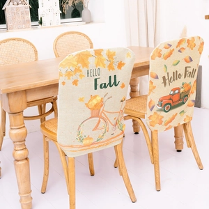 Hello Fall themed chair covers with vintage truck and maple leaf designs for autumn dining decor