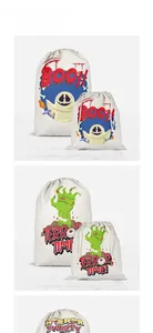 Detail showing assorted canvas Halloween candy bags with ghost and zombie hand prints