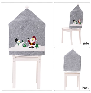 Detail view showing front, side, and back of gray Christmas chair cover with Santa print