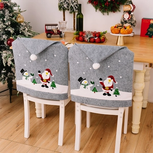 Detail of Christmas chair covers with Santa Claus and Snowman prints on grey fabric