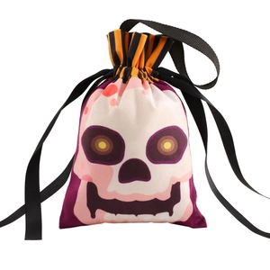 Halloween drawstring candy bag with vibrant skull print and orange striped border