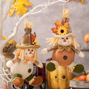 Harvest festival boy and girl scarecrow hanging dolls with autumn maple leaf accents