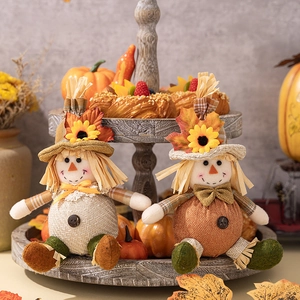 Harvest festival scarecrow couple dolls with sunflowers and maple leaves on wooden tray