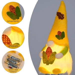 Harvest festival glowing gnome ornament with yellow maple leaves and warm LED lights