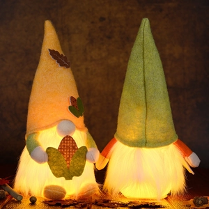 Lighted harvest festival gnomes with orange and green hats for autumn home decor