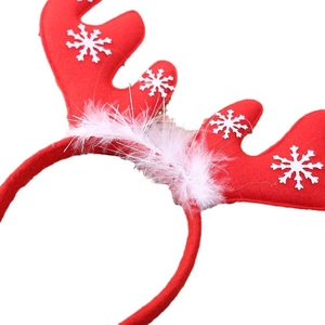 Red Christmas reindeer antler headband with white snowflakes and soft feather accents