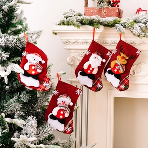 Set of 4 linen Christmas stockings featuring 3D Santa, Reindeer, and Snowmen characters