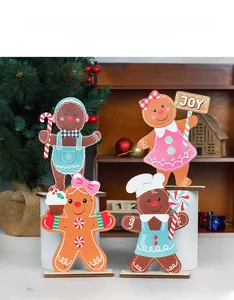 Detailed close-up of cute wooden gingerbread couple ornaments for Christmas home decor