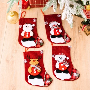 Set of 4 linen Christmas stockings with Santa, Snowman, Reindeer on wood background