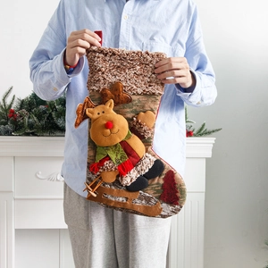 Large festive Christmas stocking with 3D reindeer skiing motif and brown fleece cuff decor