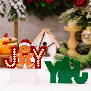 Christmas JOY wooden tabletop signs with gingerbread man and festive cedar tree background
