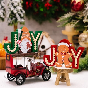 Christmas wooden JOY sign ornaments with gnome and gingerbread man for holiday table decor