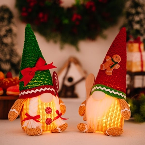 Lighted Christmas Gingerbread Gnome ornaments with green knit hats and warm LED glow
