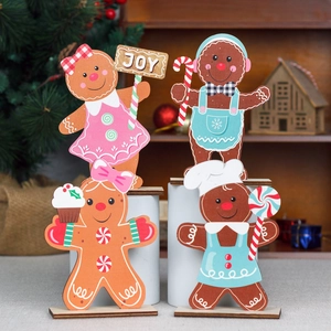 Set of four wooden Christmas gingerbread man figurines for festive tabletop decoration