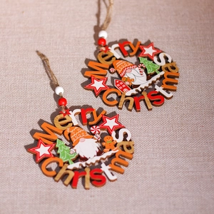 Set of two wooden Christmas gnome ornaments with gingerbread motifs and hemp ropes