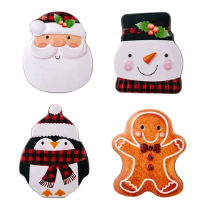 Christmas tin box set featuring Santa, Snowman, and Penguin designs in red plaid patterns