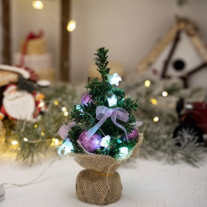 Mini lighted Christmas tree with purple baubles, LED star lights and burlap base decor